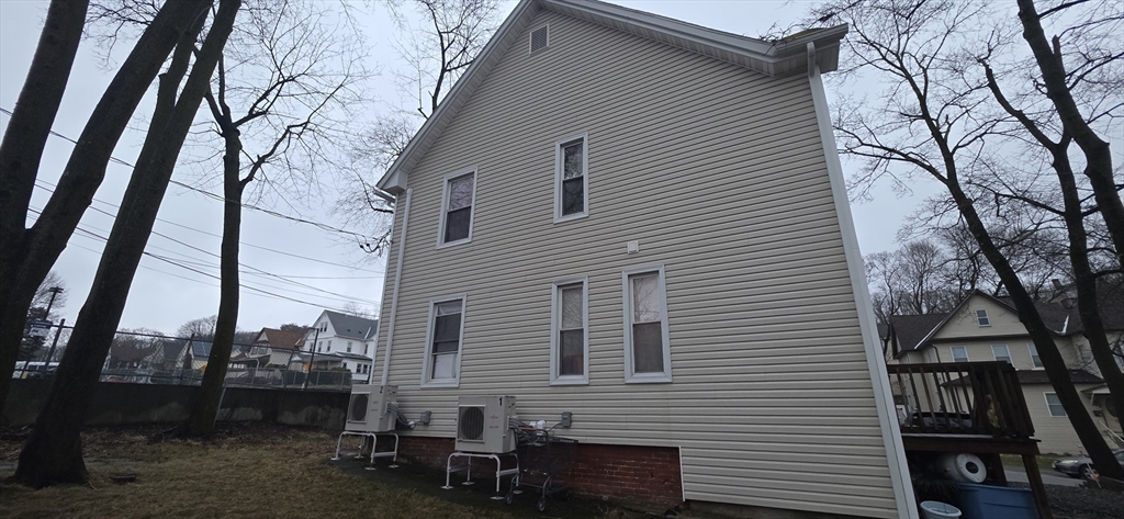 51 Uxbridge Street Worcester, MA 01605 - Photo 4 of 33 a view of a house with a yard