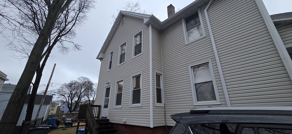 51 Uxbridge Street Worcester, MA 01605 - Photo 7 of 33 a view of a house with a yard
