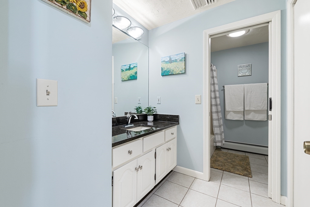 6 Crestlan Drive Worcester, MA 01604 - Photo 21 of 33 a bathroom with a granite countertop sink and a mirror