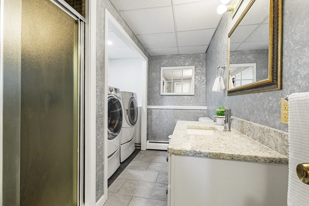 6 Crestlan Drive Worcester, MA 01604 - Photo 27 of 33 a bathroom with a granite countertop sink and a mirror