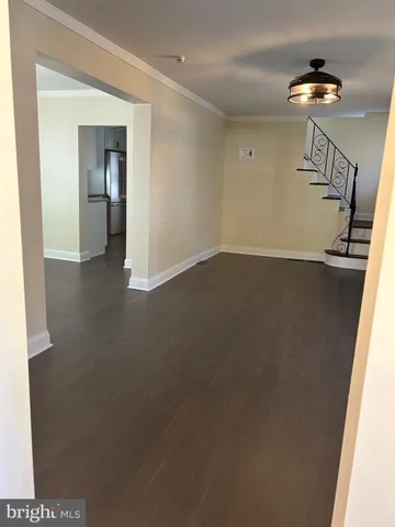 a view of an empty room with a bathroom