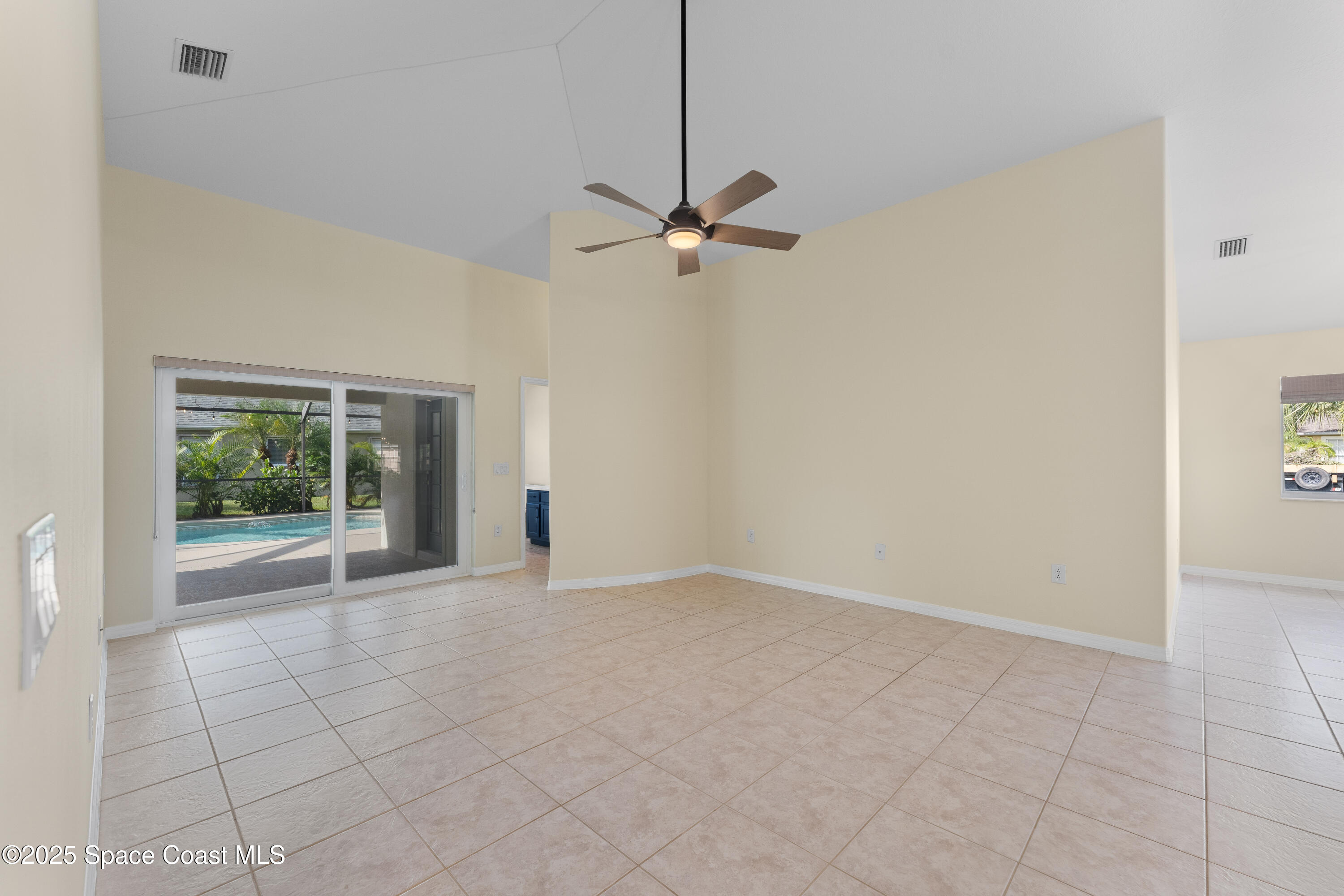 3112 Siderwheel Drive Rockledge, FL 32955 - Photo 12 of 60 an empty room with windows and fan
