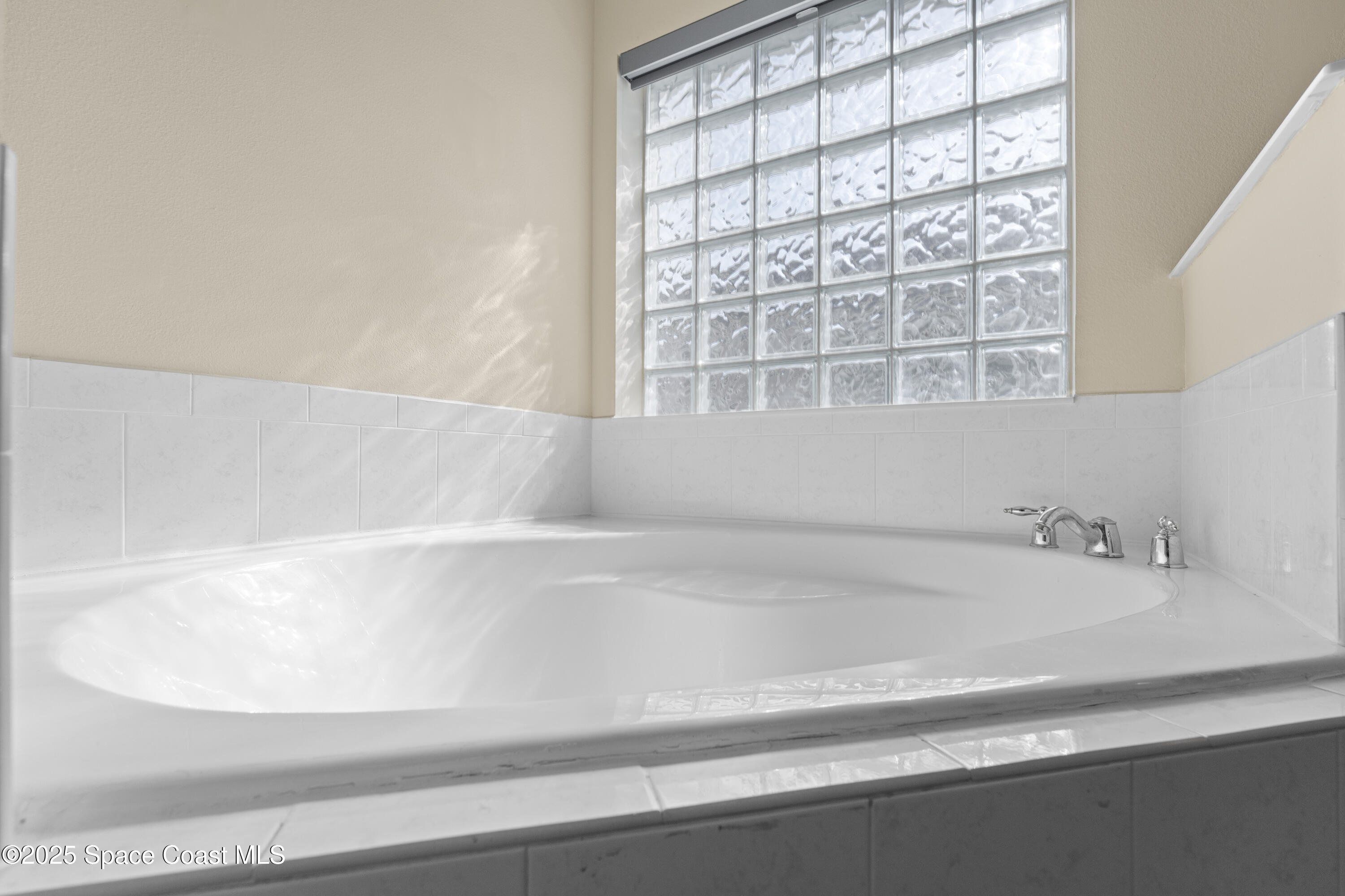 3112 Siderwheel Drive Rockledge, FL 32955 - Photo 25 of 60 a close view of a bathtub in a bathroom