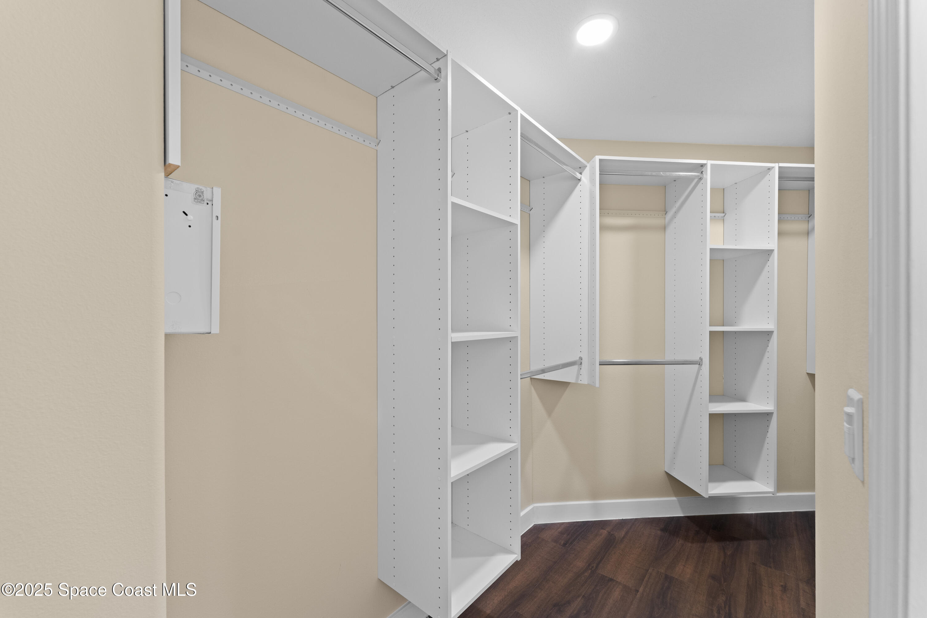 3112 Siderwheel Drive Rockledge, FL 32955 - Photo 27 of 60 a view of walk in closet with wooden floor