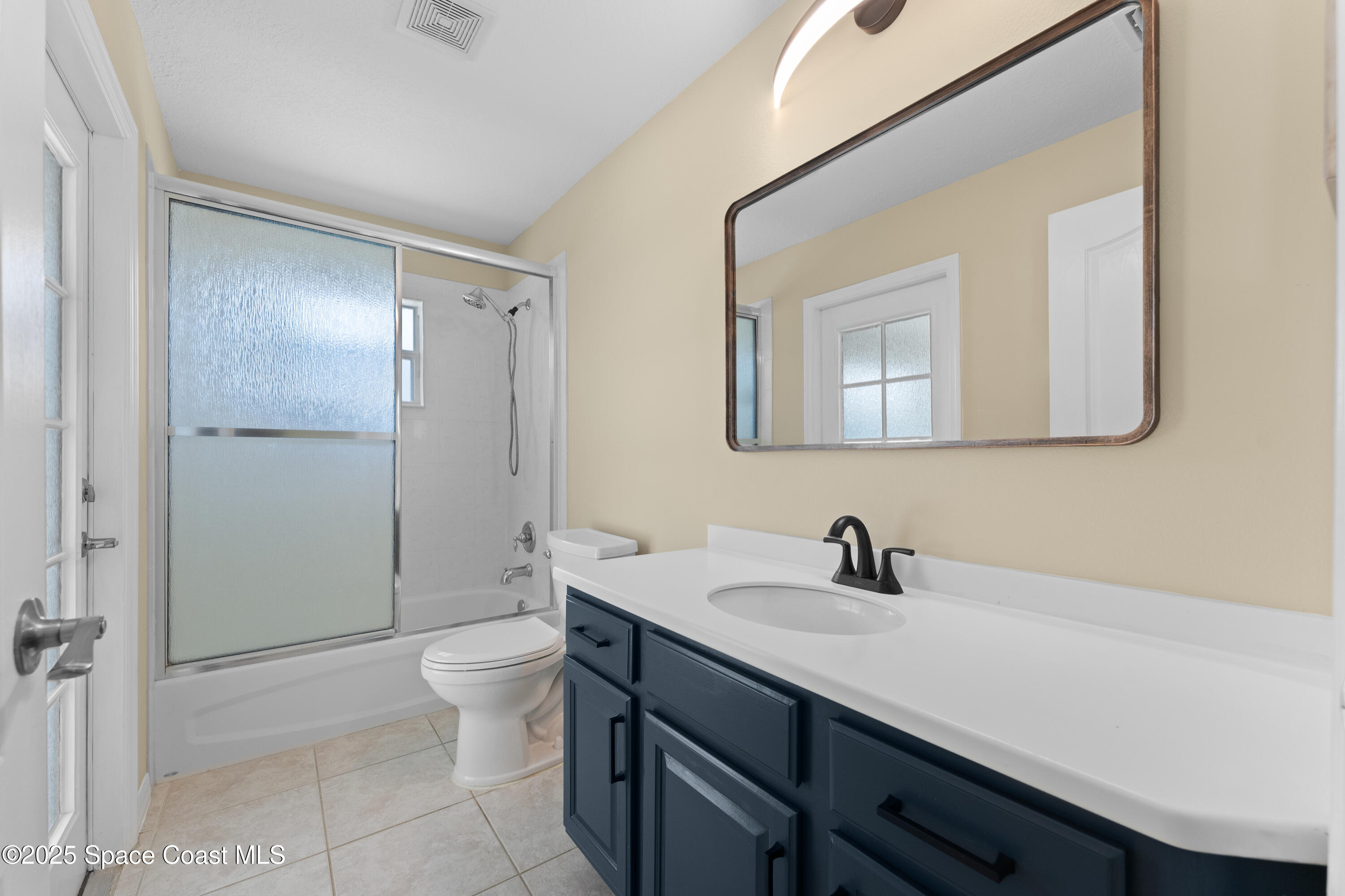 3112 Siderwheel Drive Rockledge, FL 32955 - Photo 30 of 60 a bathroom with a sink a toilet and shower