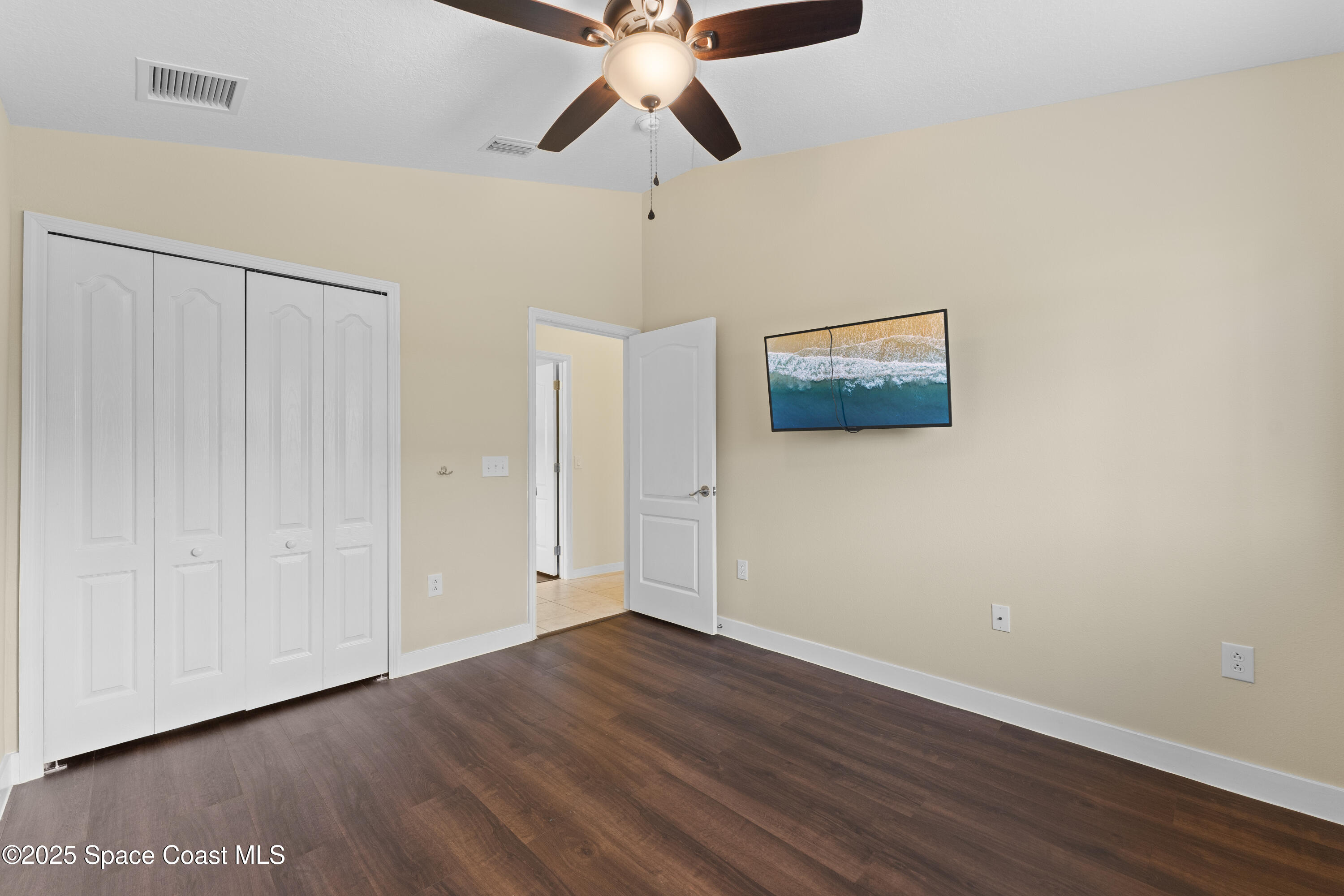 3112 Siderwheel Drive Rockledge, FL 32955 - Photo 32 of 60 a view of an empty room with wooden floor