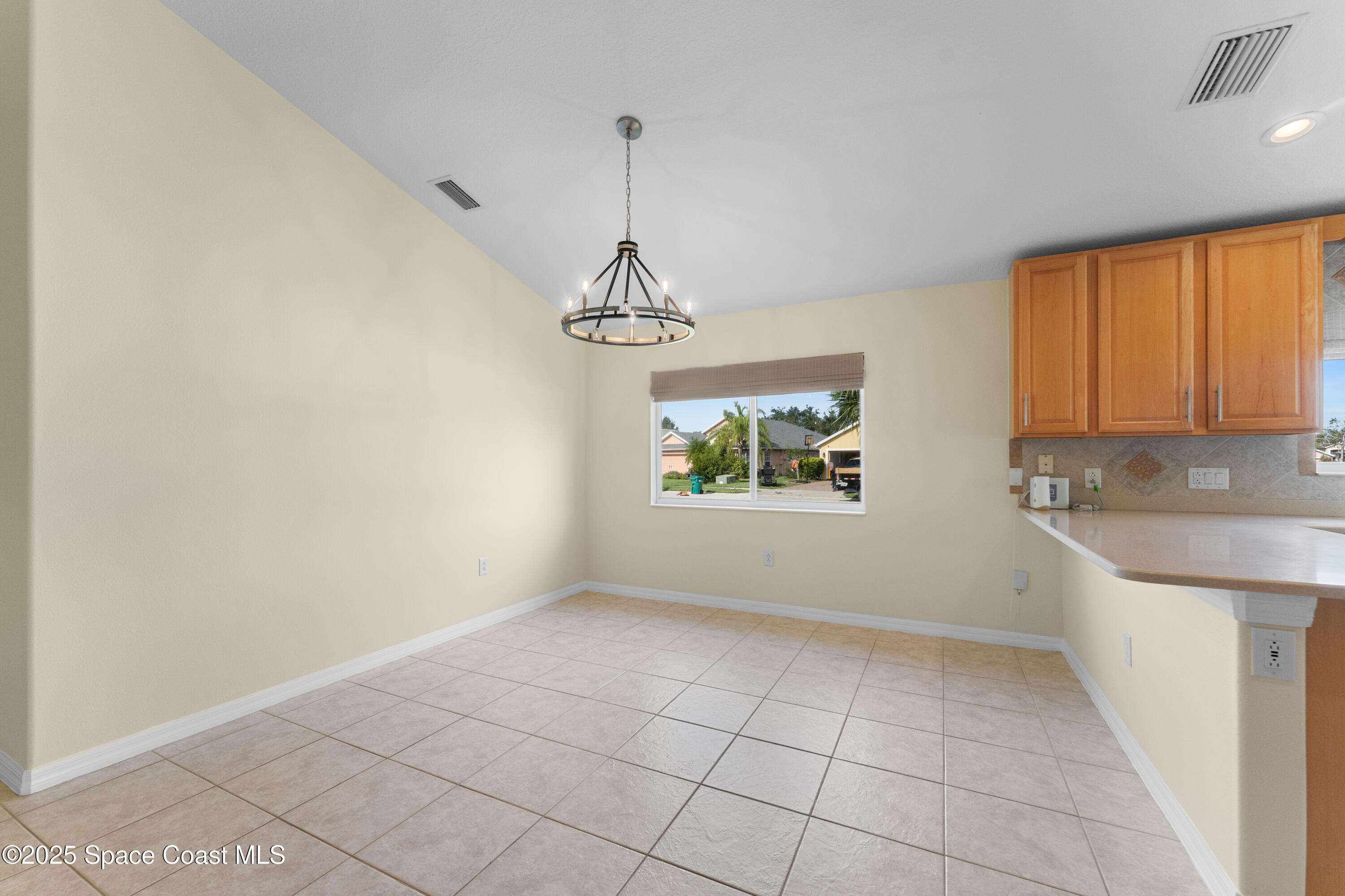3112 Siderwheel Drive Rockledge, FL 32955 - Photo 8 of 60 a view of a kitchen with a sink dishwasher and wooden floor