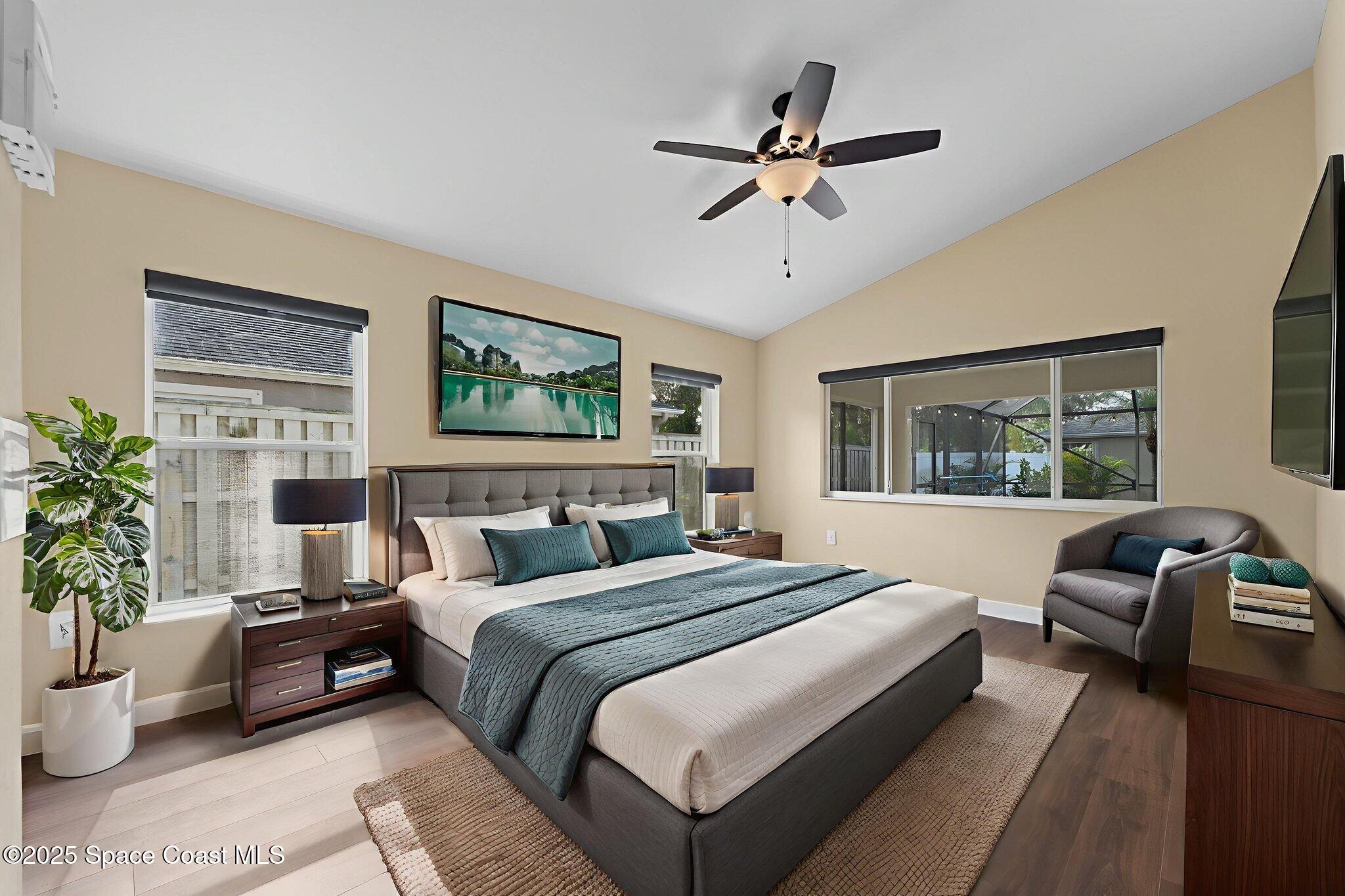 3112 Siderwheel Drive Rockledge, FL 32955 - Photo 9 of 60 a bedroom with a large bed and a window