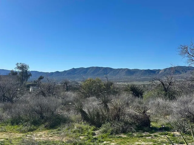 a view of a lake with mountains in the background
