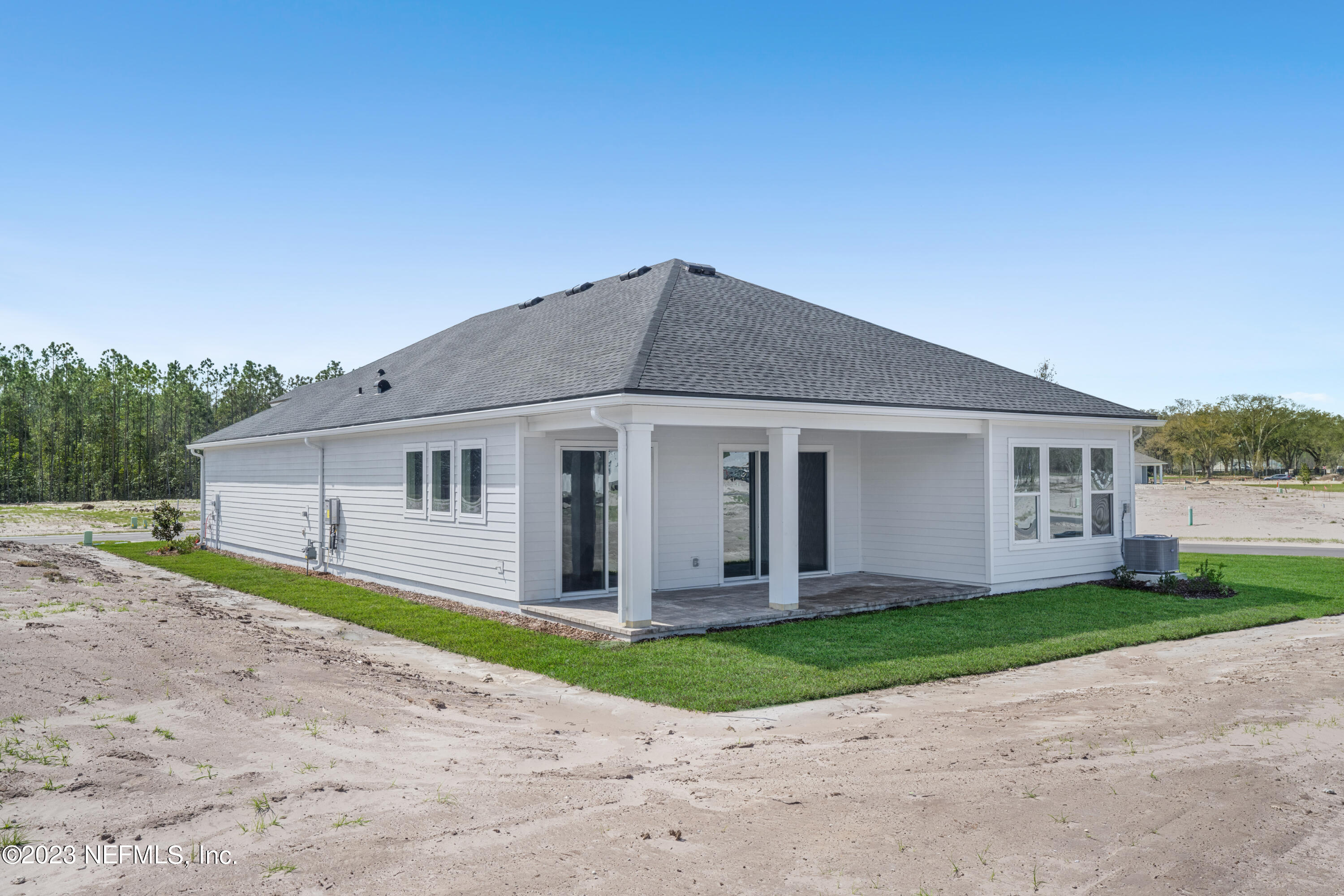 21 Willow Island Point St. Augustine, FL 32092 - Photo 12 of 14 a front view of a house with a yard and garage