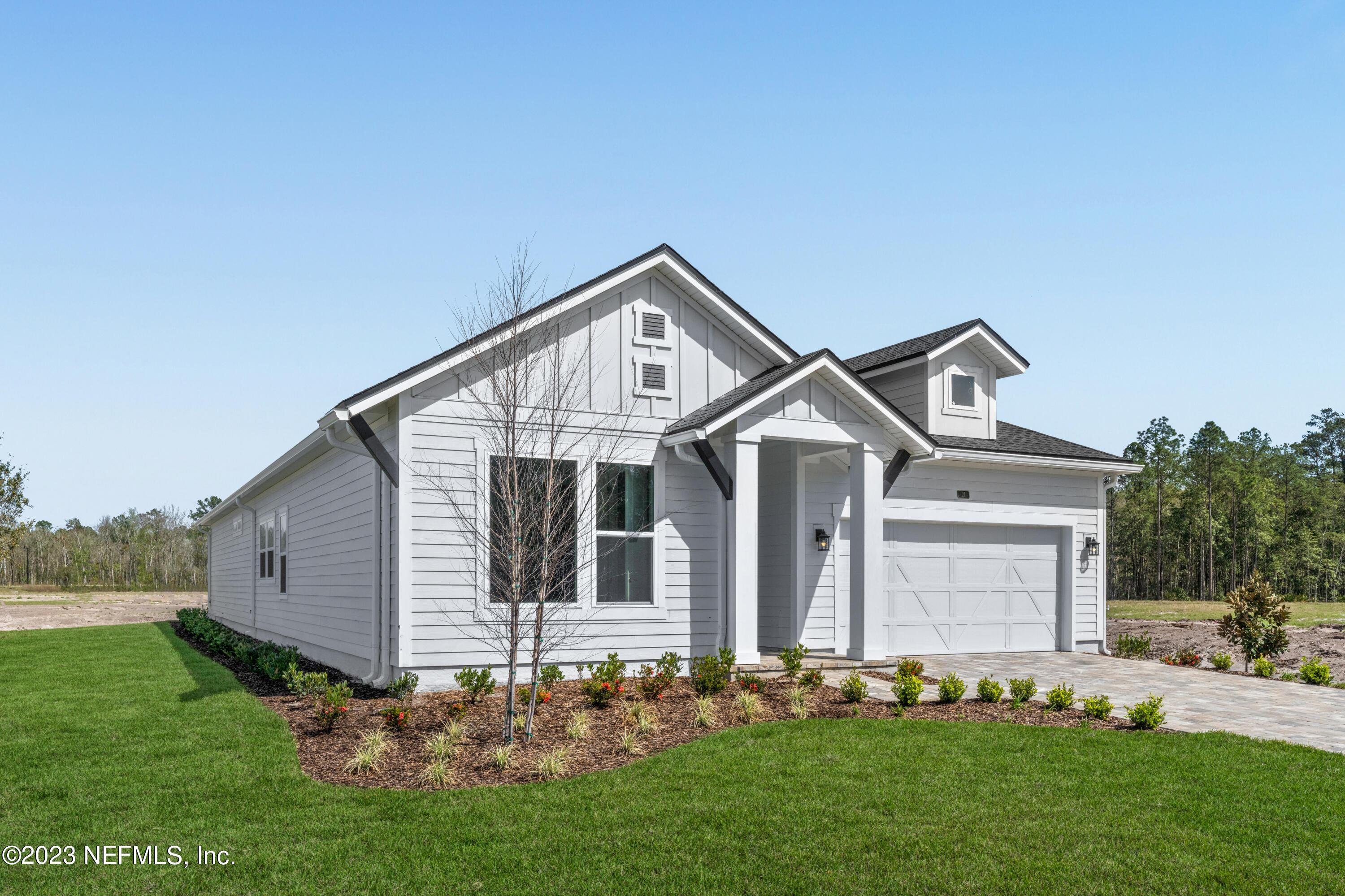 21 Willow Island Point St. Augustine, FL 32092 - Photo 2 of 14 a front view of a house with a garden