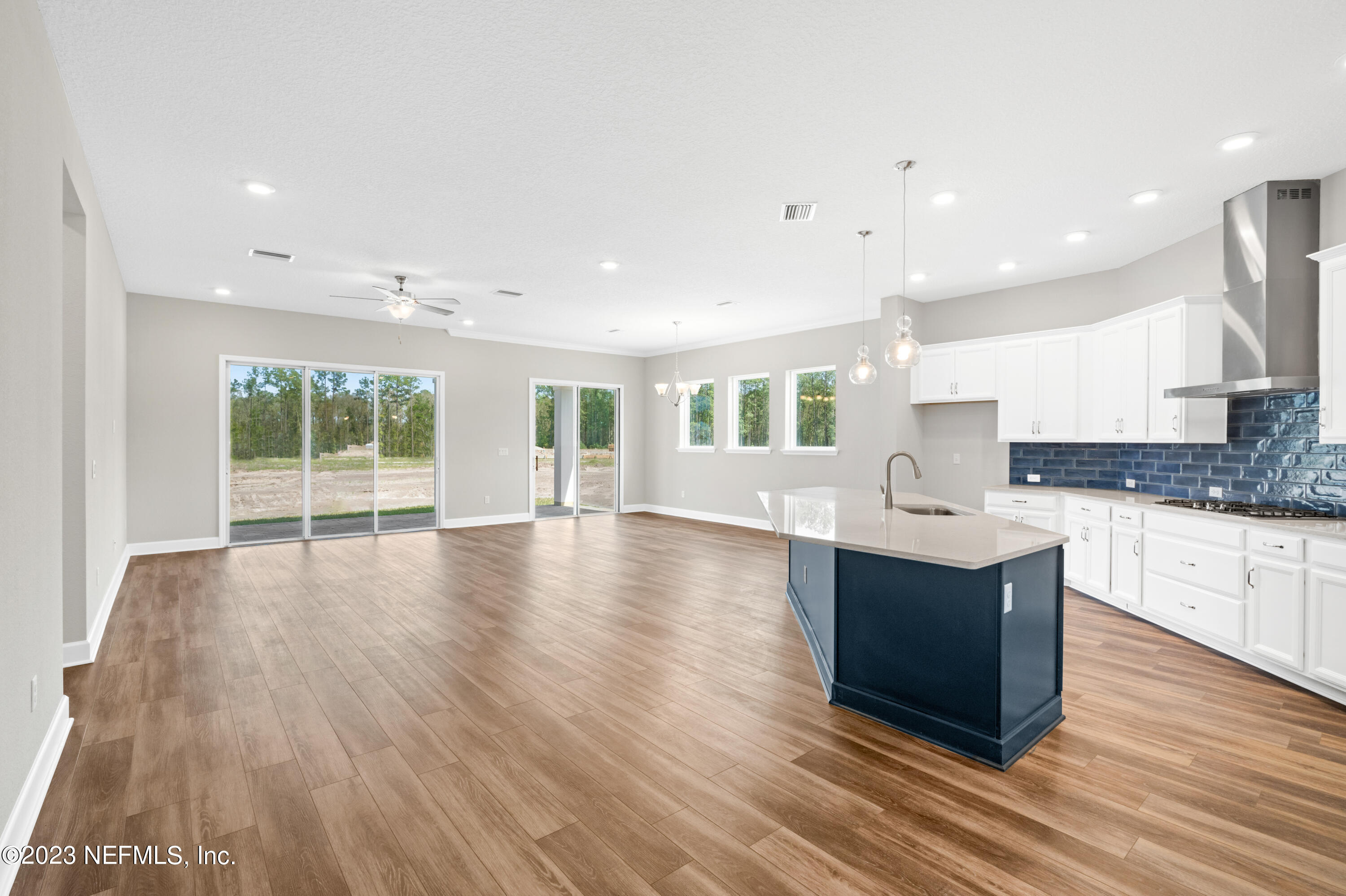 21 Willow Island Point St. Augustine, FL 32092 - Photo 5 of 14 a large kitchen with stainless steel appliances granite countertop a large counter top and a wooden floors