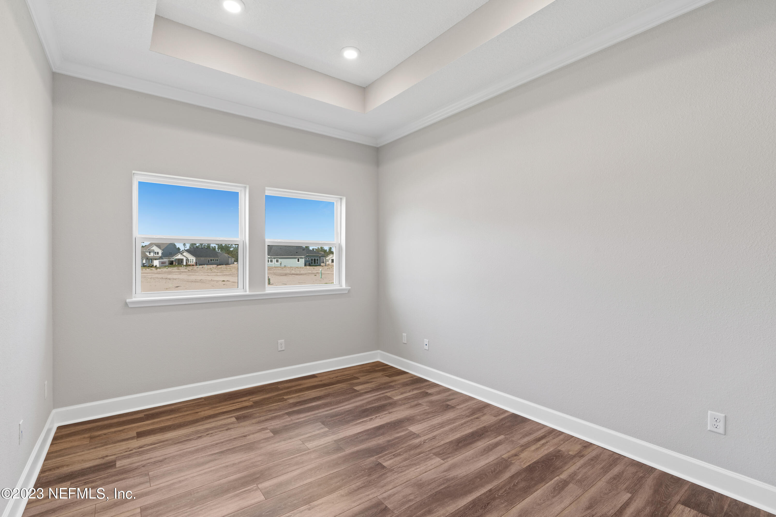 21 Willow Island Point St. Augustine, FL 32092 - Photo 7 of 14 wooden floor in an empty room with a window