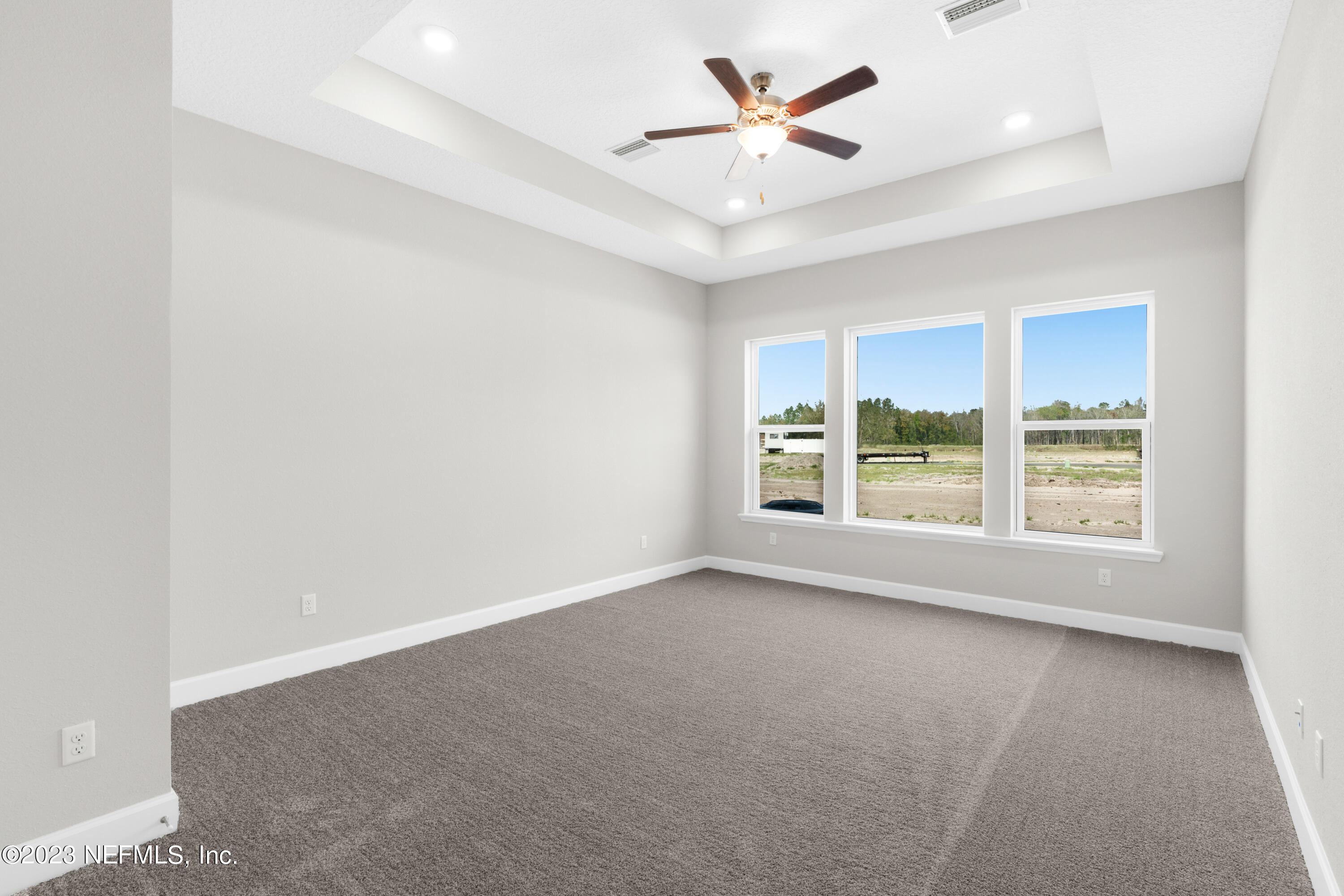 21 Willow Island Point St. Augustine, FL 32092 - Photo 8 of 14 an empty room with a window and a fan