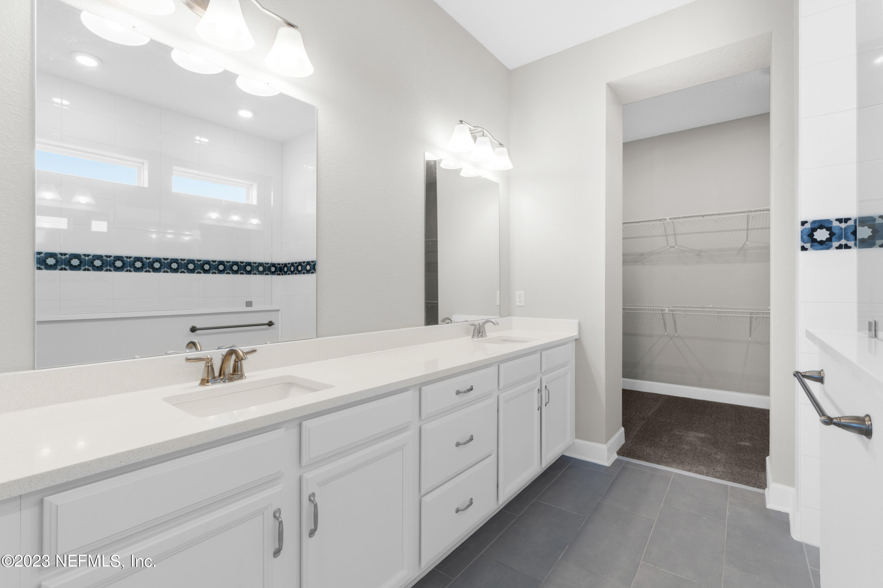21 Willow Island Point St. Augustine, FL 32092 - Photo 10 of 14 a bathroom with double vanity sink and mirror