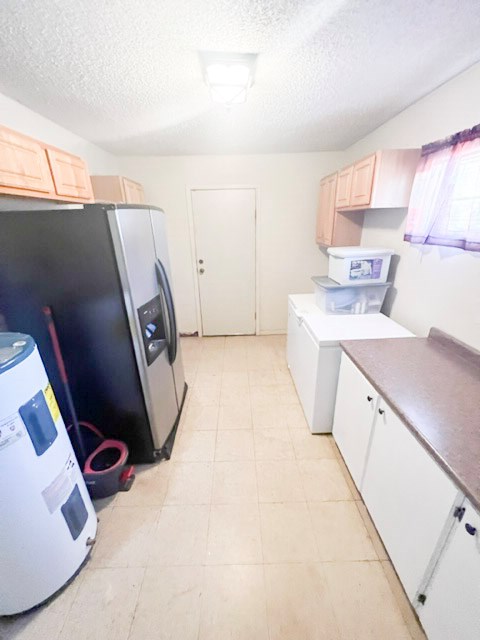 110 Cortez Buchanan Dam, TX 78609 - Photo 11 of 17 a view of a kitchen with storage and utility