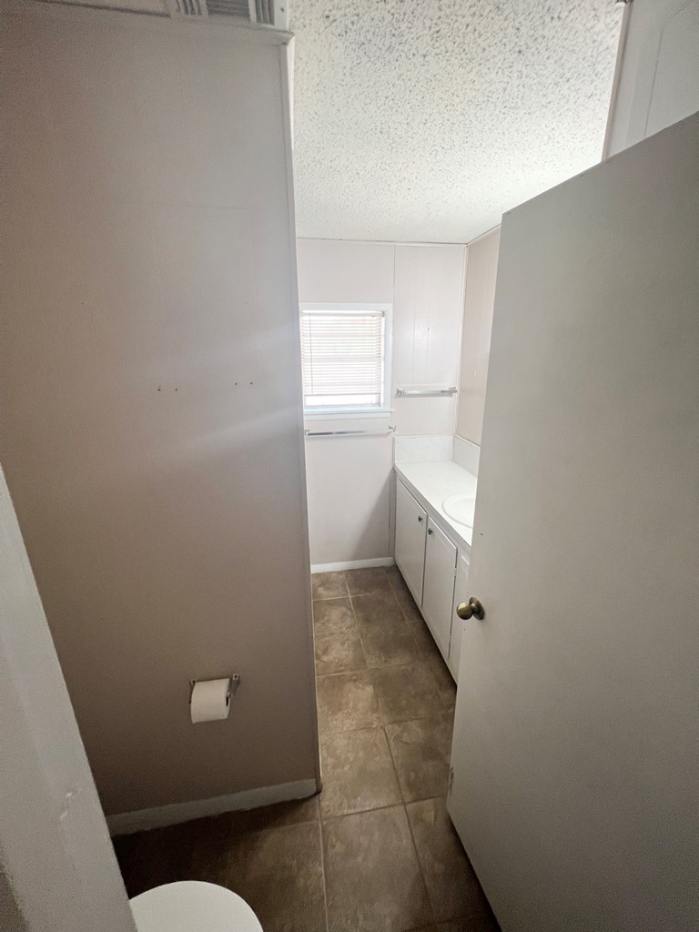110 Cortez Buchanan Dam, TX 78609 - Photo 13 of 17 a bathroom with a sink and toilet