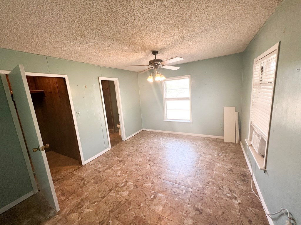 110 Cortez Buchanan Dam, TX 78609 - Photo 15 of 17 wooden floor in an empty room with a window