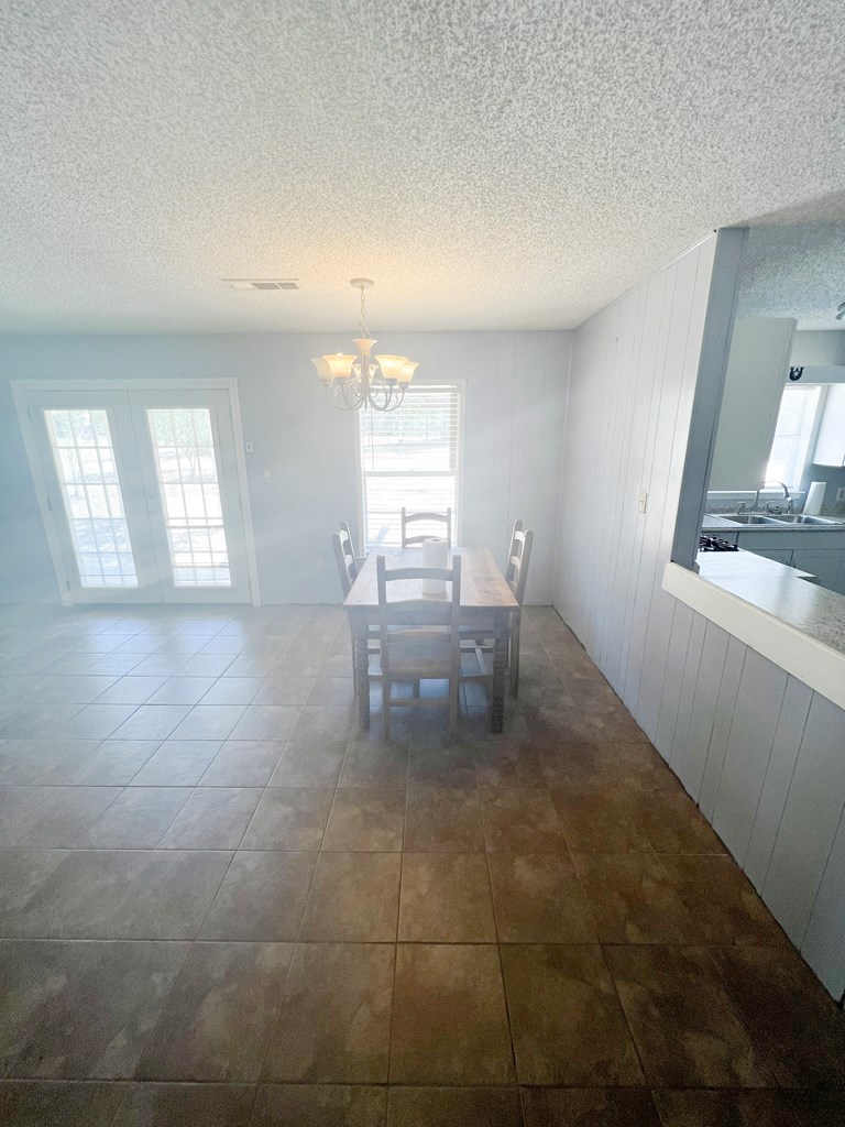 110 Cortez Buchanan Dam, TX 78609 - Photo 8 of 17 a room with window and chandelier