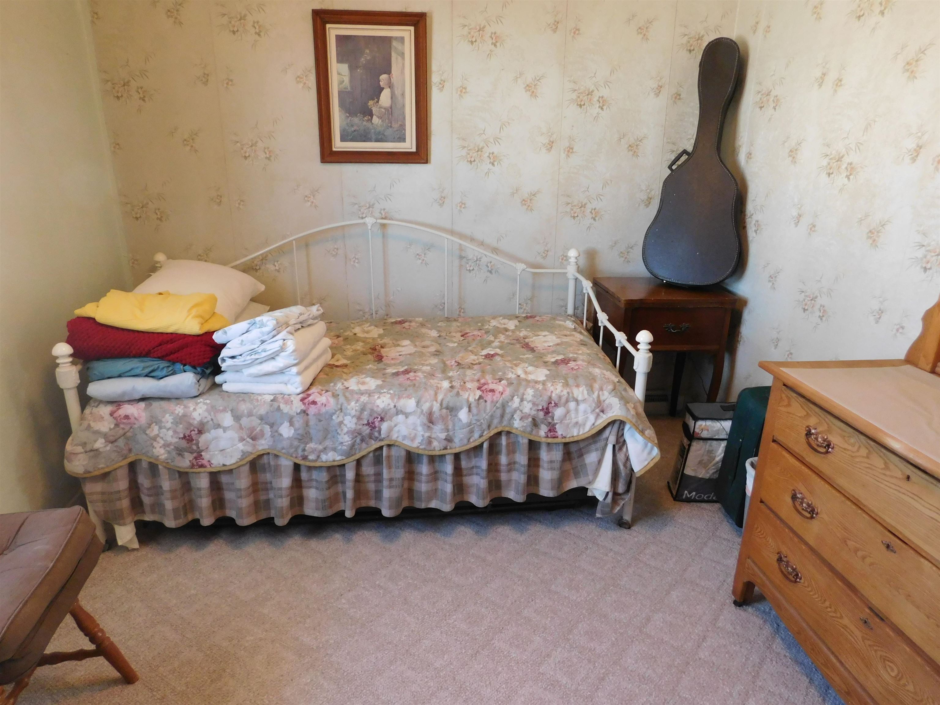 923 18 Road Fruita, CO 81521 - Photo 11 of 33 a bedroom with a bed and dresser