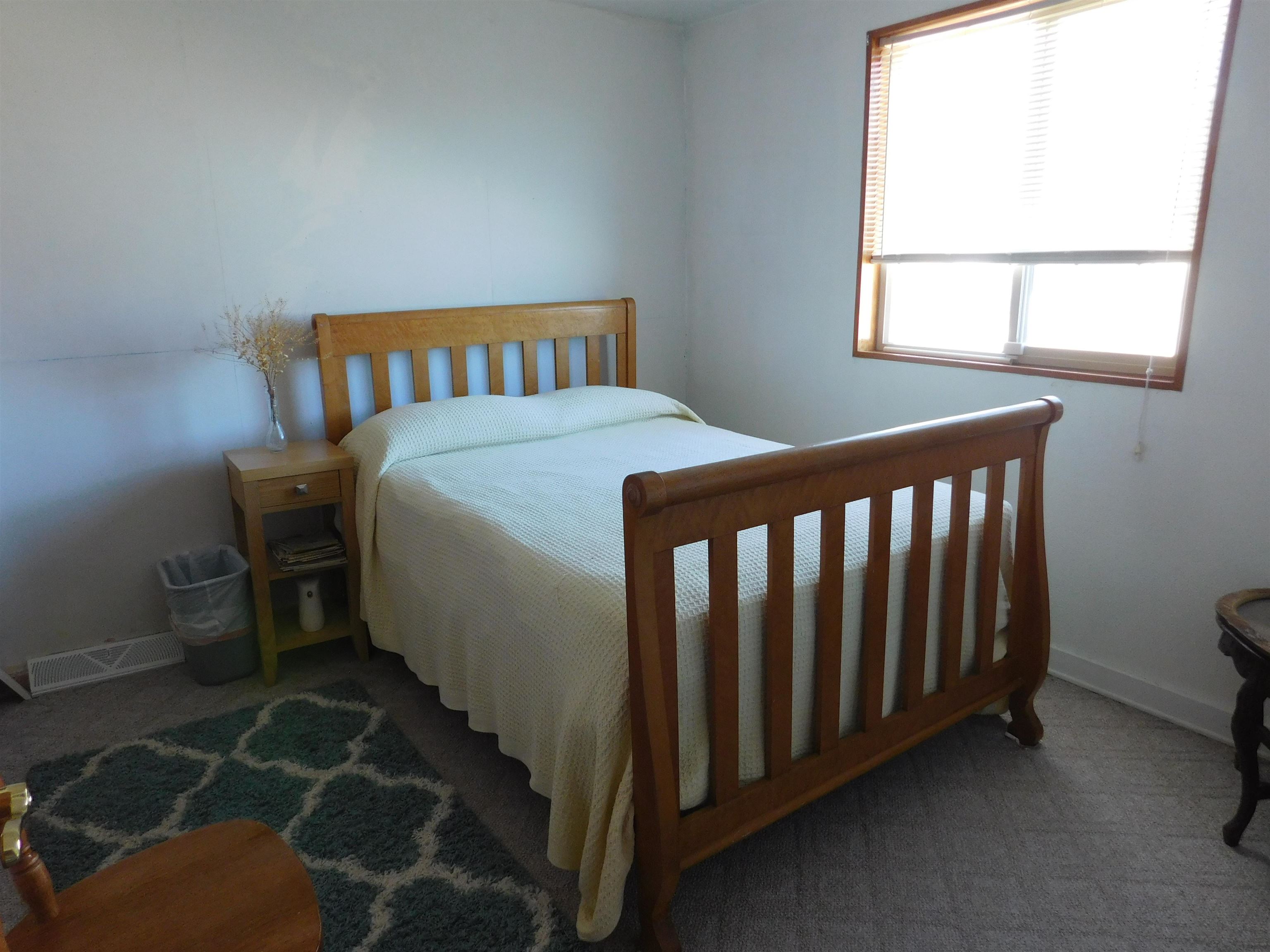923 18 Road Fruita, CO 81521 - Photo 9 of 33 a bedroom with a bed and a window
