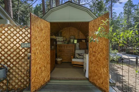 a view of a back yard of the house and a chair