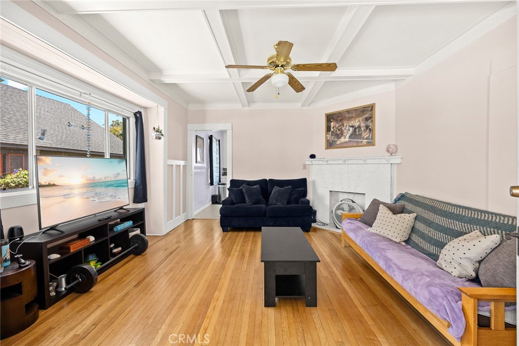 1156 Steuben Street Pasadena, CA 91106 - Photo 12 of 36 a living room with furniture and a flat screen tv