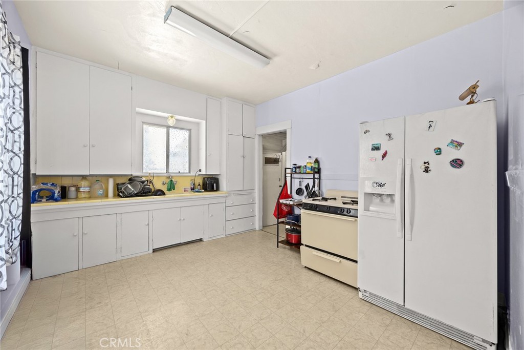 1156 Steuben Street Pasadena, CA 91106 - Photo 15 of 36 a kitchen with stainless steel appliances a refrigerator sink and cabinets