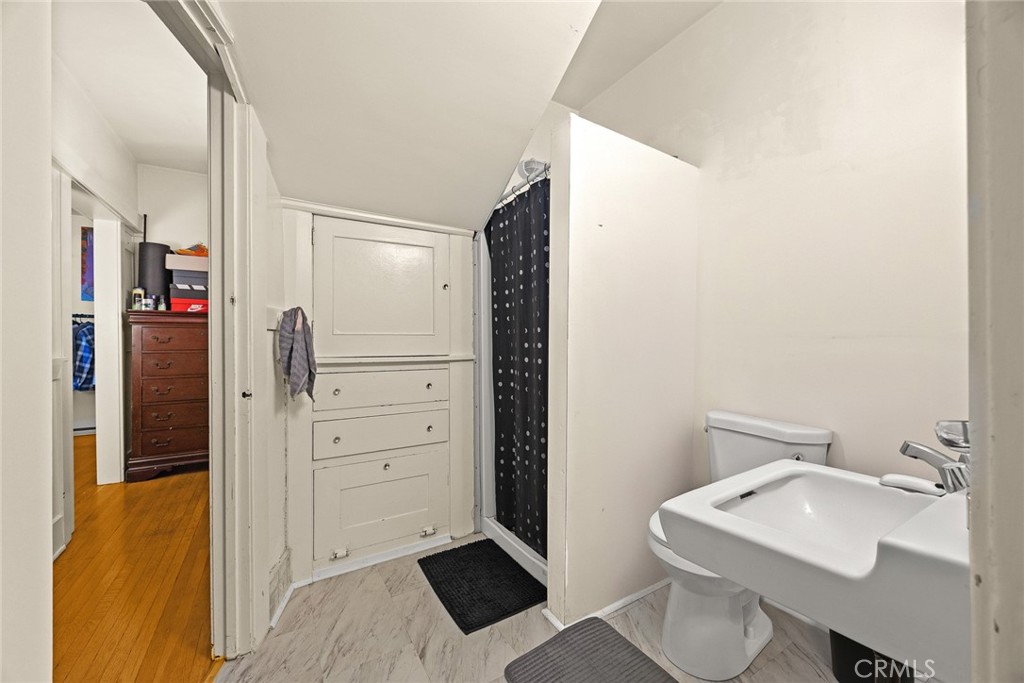 1156 Steuben Street Pasadena, CA 91106 - Photo 20 of 36 a bathroom with a sink a toilet and shower