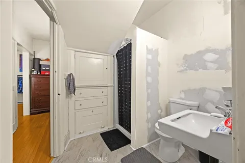 a bed room with a bed and a television