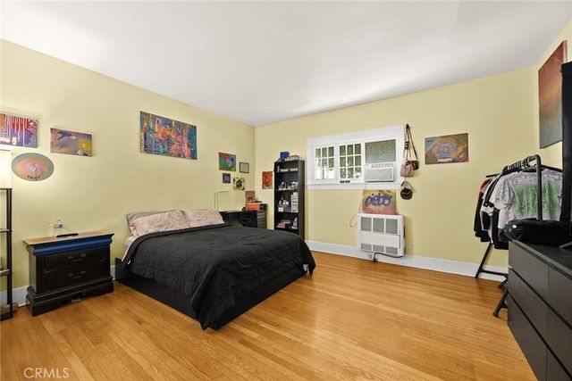 a bedroom with a bed and a table