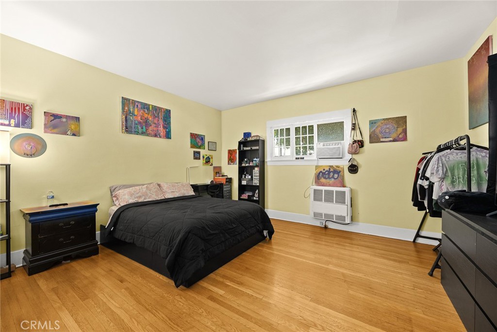 1156 Steuben Street Pasadena, CA 91106 - Photo 23 of 36 a bedroom with a bed and a dresser