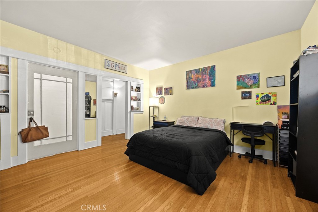 1156 Steuben Street Pasadena, CA 91106 - Photo 24 of 36 a bedroom with a bed and a table