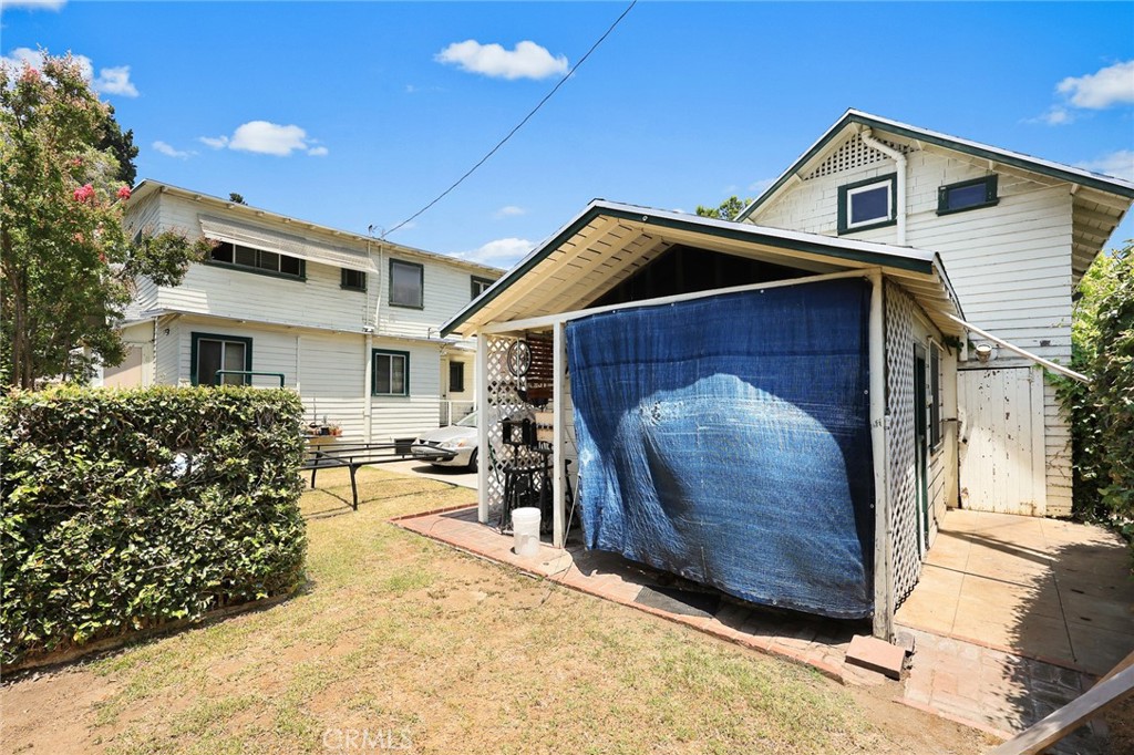 1156 Steuben Street Pasadena, CA 91106 - Photo 31 of 36 a front view of a house with a yard