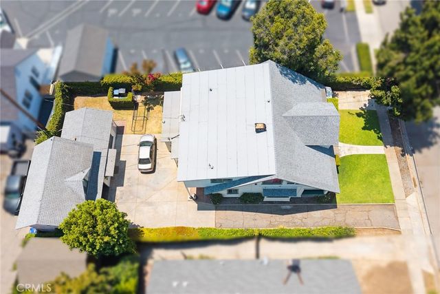 an aerial view of residential house with an outdoor space