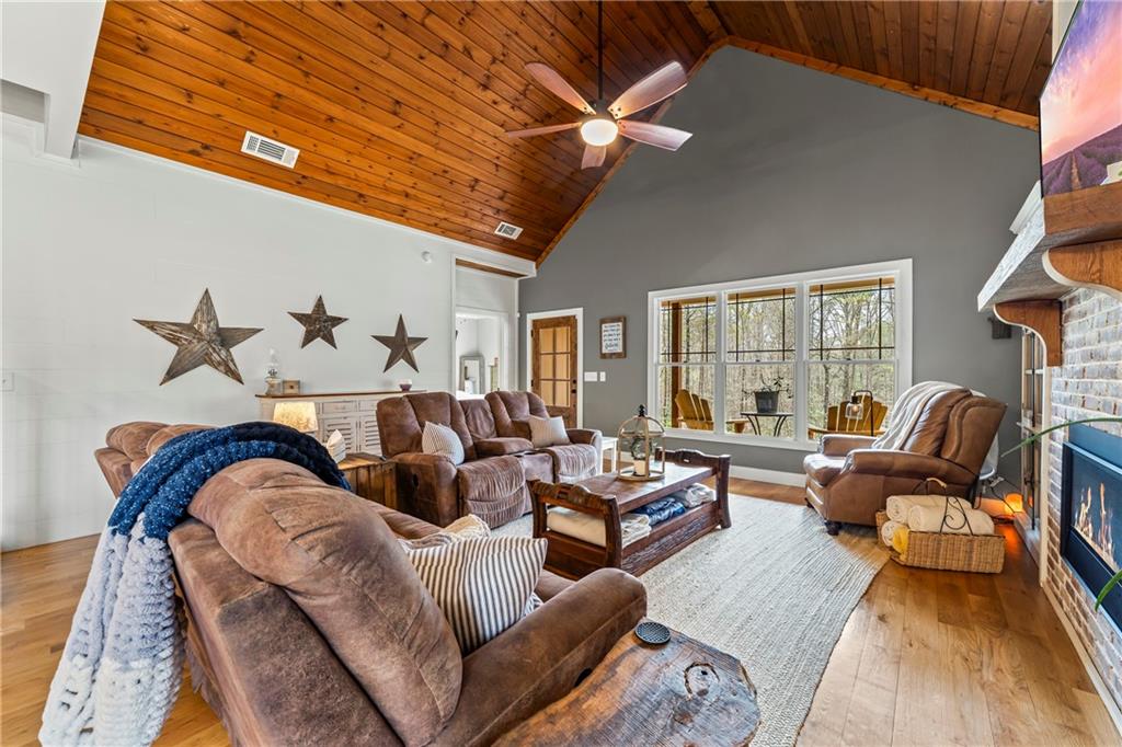 5240 Highway 17 Clarkesville, GA 30523 - Photo 28 of 82 a living room with furniture fireplace and a large window