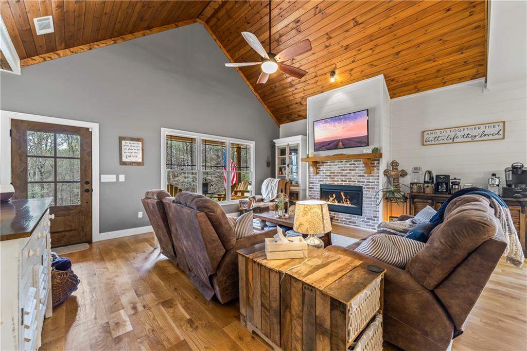5240 Highway 17 Clarkesville, GA 30523 - Photo 29 of 82 a living room with fireplace furniture and a rug