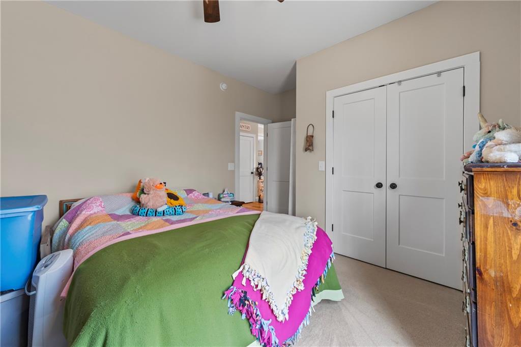 5240 Highway 17 Clarkesville, GA 30523 - Photo 45 of 82 a bedroom with a bed and a couch