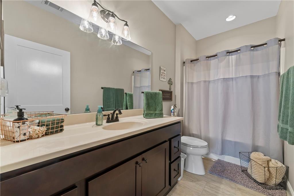 5240 Highway 17 Clarkesville, GA 30523 - Photo 46 of 82 a bathroom with a double vanity sink mirror and toilet