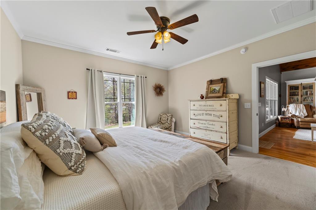 5240 Highway 17 Clarkesville, GA 30523 - Photo 52 of 82 a bedroom with a bed and a large window