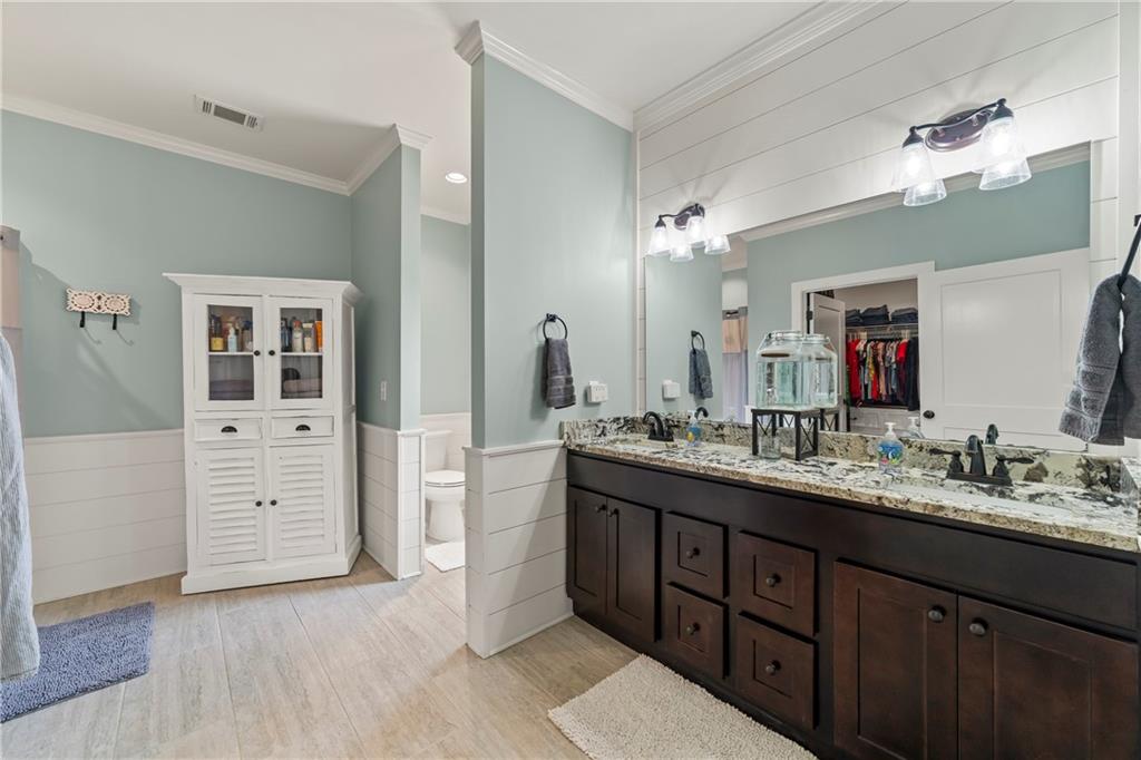 5240 Highway 17 Clarkesville, GA 30523 - Photo 53 of 82 a bathroom with a sink vanity and a mirror