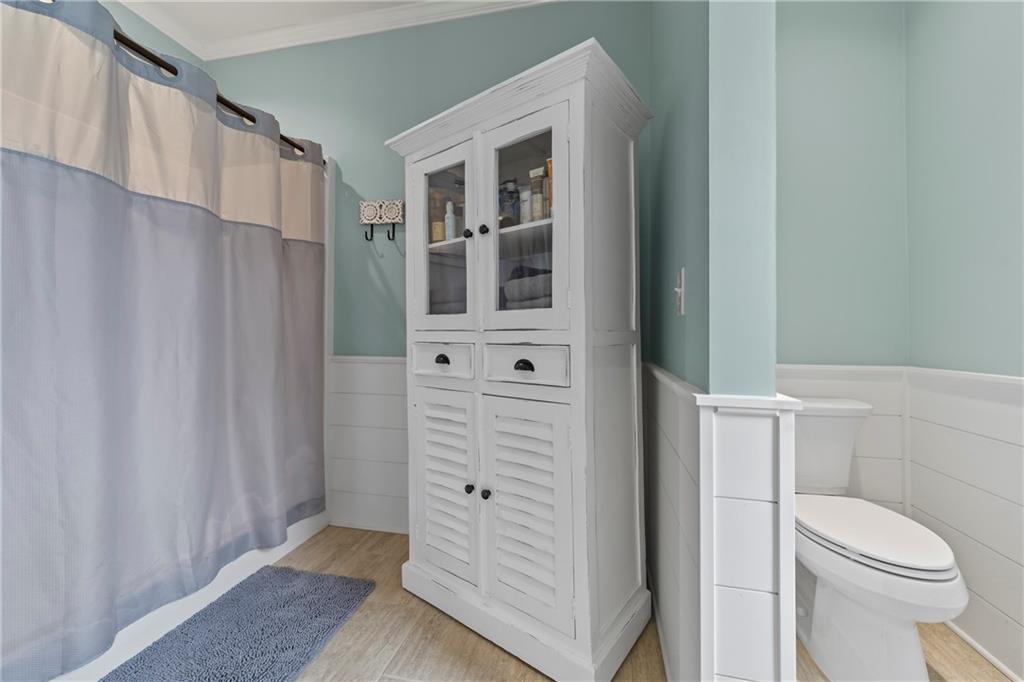 5240 Highway 17 Clarkesville, GA 30523 - Photo 54 of 82 a bathroom with a shower toilet and sink