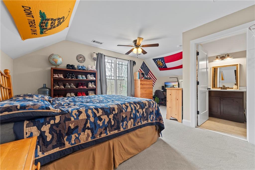 5240 Highway 17 Clarkesville, GA 30523 - Photo 60 of 82 a bedroom with a bed and dresser