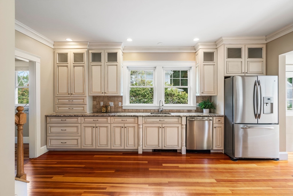 44 Norfolk Street Needham, MA 02492 - Photo 12 of 28 a kitchen with stainless steel appliances granite countertop a refrigerator and a stove top oven