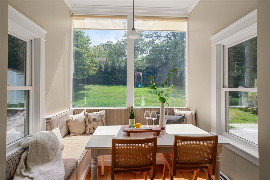 44 Norfolk Street Needham, MA 02492 - Photo 14 of 28 a dining room with furniture a large window and a table