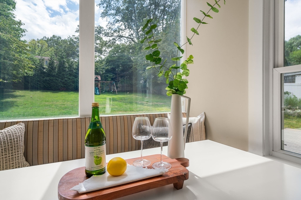 44 Norfolk Street Needham, MA 02492 - Photo 15 of 28 a wooden bench sitting in the middle of a yard