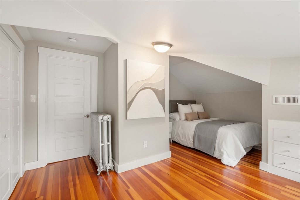 44 Norfolk Street Needham, MA 02492 - Photo 24 of 28 a bedroom with a bed and a dresser