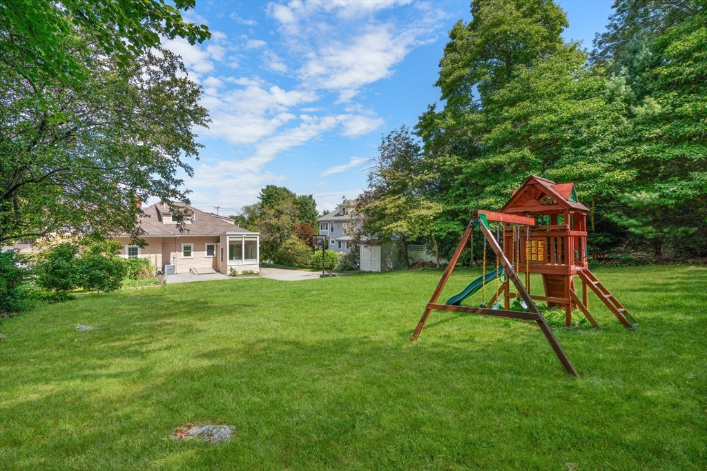 44 Norfolk Street Needham, MA 02492 - Photo 27 of 28 a view of a house with a yard potted plants and a tree