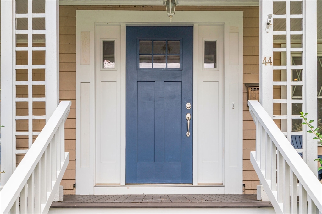 44 Norfolk Street Needham, MA 02492 - Photo 4 of 28 a view of a staircase with wooden floor and a front door