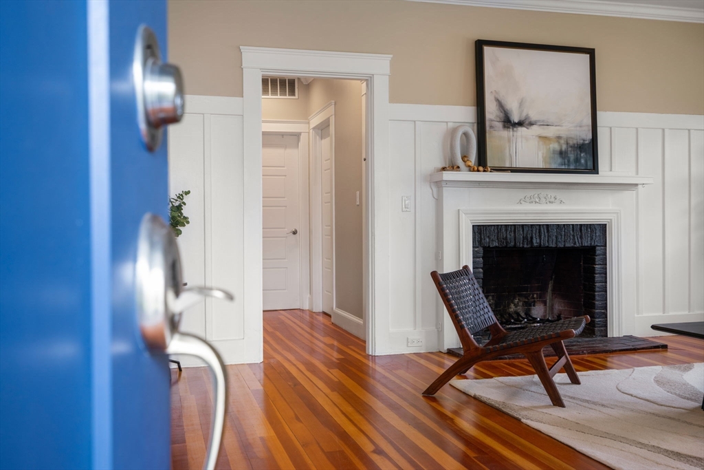 44 Norfolk Street Needham, MA 02492 - Photo 5 of 28 a living room with furniture and a fireplace